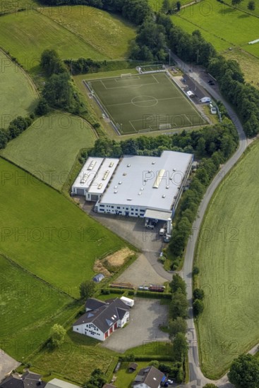 Aerial view, company premises Lange GmbH Metallverarbeitung und Sportplatz SpVg Iseringhausen, Iseringhausen, Drolshagen, Sauerland, North Rhine-Westphalia, Germany, DE, Europe, football pitch, football stadium, football club, commercial enterprises, commercial area, commercial area, commercial location, commercial use, industrial area, industrial location, aerial view, aerial photography, aerial photography, sports, sports facilities, sports field, sports facility, overview, bird's eye view, birds-eyes view, overview