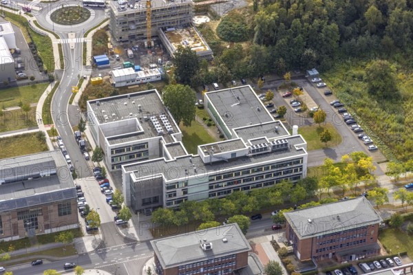 Phoenix-West area with company buildings MST Factory and ION-GAS GmbH on Konrad-Adenauer-Allee in the Hörde district of Dortmund, Ruhr area, North Rhine-Westphalia, Germany, Bartels Mikrotechnik GmbH, DE, Dortmund, Europe, commercial enterprises, commercial area, industrial estate, business park, commercial location, commercial use, industrial area, industrial building, industrial location, innovation location, aerial view, aerial photograph, aerial photography, aerial photography, Micronit GmbH, Phönix-West, overview, bird's-eye view, birds-eyes view, former blast furnace plant, overview, temicon GmbH