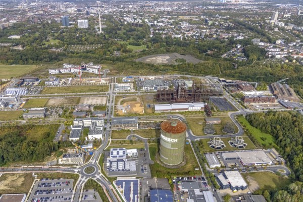 Phönix-West area and Hoesch-Gasometer as well as construction site for new building at the roundabout Nortkirchenstraße Olof-palm tree-Straße and in the background the Westfalenpark with Florianturm in the district Hörde in Dortmund, Ruhr area, North Rhine-Westphalia, Germany, Albonair, Amprion GmbH electricity supplier, construction work, construction area, construction site, building plots, construction project, construction site, construction site Robert-Schuman-Straße, Carlo-Schmid-Allee, DE, Dortmund, Europe, commercial enterprises, commercial area, commercial park, commercial location, commercial use, industrial area, industrial building, industrial location, innovation location, roundabout, roundabout, aerial view, aerial photograph, aerial photography, aerial photography, Maschmeyer GmbH Karosserie- und Lackier-Zentrum Dortmund, new building, Phönix-West, overview, bird's eye view, centre for production technology, birds-eyes view, former blast furnace plant, overview