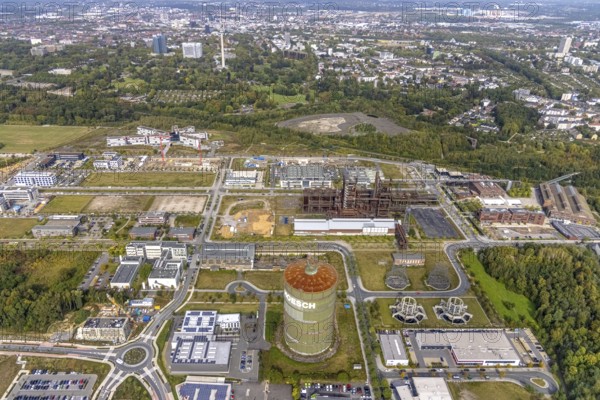 Phönix-West area and Hoesch-Gasometer as well as construction site for new building at the roundabout Nortkirchenstraße Olof-palm tree-Straße and in the background the Westfalenpark with Florianturm in the district Hörde in Dortmund, Ruhr area, North Rhine-Westphalia, Germany, Albonair, Amprion GmbH electricity supplier, construction work, construction area, construction site, building plots, construction project, construction site, construction site Robert-Schuman-Straße, Carlo-Schmid-Allee, DE, Dortmund, Europe, commercial enterprises, commercial area, commercial park, commercial location, commercial use, industrial area, industrial building, industrial location, innovation location, roundabout, roundabout, aerial view, aerial photograph, aerial photography, aerial photography, Maschmeyer GmbH Karosserie- und Lackier-Zentrum Dortmund, new building, Phönix-West, overview, bird's eye view, centre for production technology, birds-eyes view, former blast furnace plant, overview