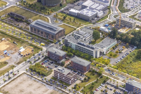 Phönix-West area with company buildings MST Factory and ION-GAS GmbH on Konrad-Adenauer-Allee and construction site for new building at the roundabout Nortkirchenstraße Olof-palm tree-Straße in the district Hörde in Dortmund, Ruhr area, North Rhine-Westphalia, Germany, Bartels Mikrotechnik GmbH, construction work, construction area, construction site, building plots, construction project, construction site, DE, Dortmund, Europe, commercial enterprises, commercial area, commercial area, commercial park, commercial location, commercial use, industrial area, industrial building, industrial location, innovation location, aerial photograph, aerial photography, aerial photography, aerial photography, Micronit GmbH, new building, Phönix-West, overview, bird's eye view, old factory building, birds-eyes view, former blast furnace plant, overview, temicon GmbH