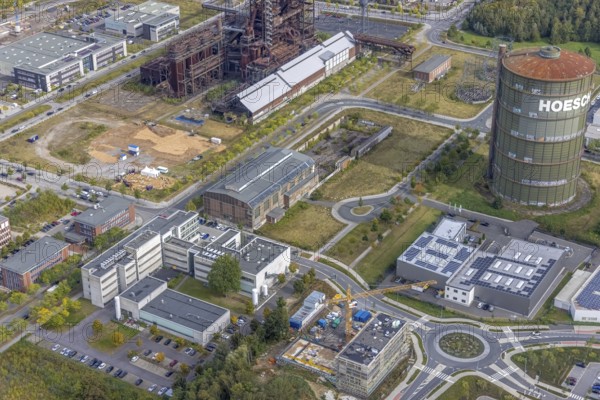 Phönix-West area and Hoesch-Gasometer and KIS Antriebstechnik GmbH with solar roof as well as company building Konrad-Adenauer-Allee with old factory building in the district Hörde in Dortmund, Ruhr area, North Rhine-Westphalia, Germany, Bartels Mikrotechnik GmbH, DE, Dortmund, Europe, commercial enterprises, commercial area, industrial area, industrial park, commercial location, commercial use, ION-GAS GmbH, industrial area, industrial building, industrial location, innovation location, aerial view, aerial photograph, aerial photography, aerial photography, MST Factory, Micronit GmbH, Phönix-West, overview, bird's-eye view, birds-eyes view, former blast furnace plant, overview