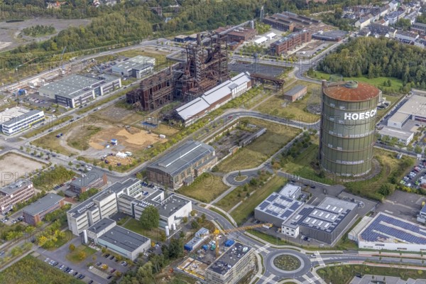 Phönix-West area and Hoesch-Gasometer and blast furnace plant as well as KIS Antriebstechnik GmbH with solar roof and company building Konrad-Adenauer-Allee with old factory building in the district Hörde in Dortmund, Ruhr area, North Rhine-Westphalia, Germany, Albonair, Bartels Mikrotechnik GmbH, DE, Dortmund, Europe, commercial enterprises, commercial area, industrial area, industrial park, commercial location, commercial use, ION-GAS GmbH, industrial area, industrial building, industrial location, innovation location, aerial view, aerial photograph, aerial photography, aerial photography, MST Factory, Micronit GmbH, Phönix-West, overview, bird's eye view, centre for production technology, birds-eyes view, former blast furnace plant, overview