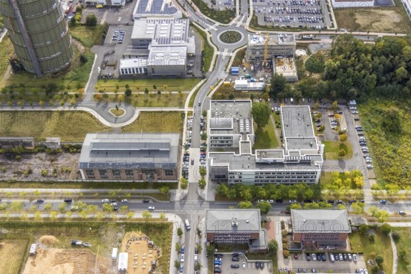 Phönix-West area with company building MST Factory and ION-GAS GmbH on Konrad-Adenauer-Allee and construction site for new building at the roundabout Nortkirchenstraße Olof-palm tree-Straße in the district Hörde in Dortmund, Ruhr area, North Rhine-Westphalia, Germany, Bartels Mikrotechnik GmbH, construction work, construction area, construction site, building plots, construction project, construction site, DE, Dortmund, Europe, commercial enterprises, commercial area, commercial park, commercial location, commercial use, ION-GAS GmbH, industrial area, industrial building, industrial location, innovation location, aerial view, aerial photograph, aerial photography, aerial photography, MST Factory, Micronit GmbH, new building, Phönix-West, overview, bird's eye view, old factory building, birds-eyes view, former blast furnace plant, overview, temicon GmbH