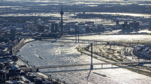 Aerial view, river Rhine with Oberkasseler Brücke, Rheinkniebrücke and Rheinturm, Altstadt, Düsseldorf, Rhineland, North Rhine-Westphalia, Germany, bridge, DE, Europe, river Rhine, aerial view, aerial photography, aerial photography, snow, tower, overview, bird's eye view, winter, birds-eyes view, overview