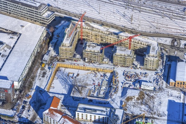 Aerial view, construction site of the new Centre for Digitisation and Digitality (ZDD) on the campus of Düsseldorf University of Applied Sciences, Derendorf, Düsseldorf, Rhineland, North Rhine-Westphalia, Germany, construction work, construction area, building site, building plots, construction project, construction site, DE, Elfriede Bial Straße, Europe, aerial photograph, aerial photography, aerial photography, new building, Rose Ausländer Straße, snow, overview, bird's-eye view, winter, birds-eyes view, overview