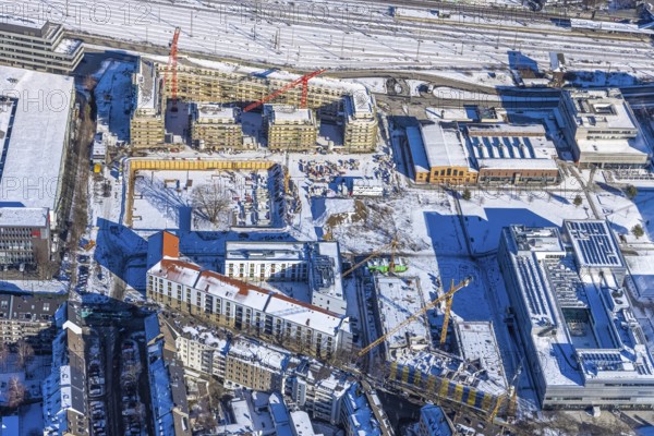 Aerial view, construction site of the new Centre for Digitisation and Digitality (ZDD) on the campus of Düsseldorf University of Applied Sciences, Derendorf, Düsseldorf, Rhineland, North Rhine-Westphalia, Germany, construction work, construction area, building site, building plots, construction project, construction site, DE, Elfriede Bial Straße, Europe, aerial photograph, aerial photography, aerial photography, new building, Rose Ausländer Straße, snow, overview, bird's-eye view, winter, birds-eyes view, overview