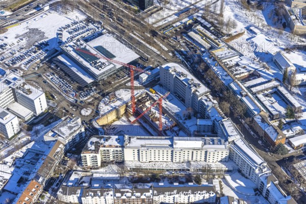Aerial view, construction site new building office and residential complex, UpperNord Tower Düsseldorf, Mercedesstraße, Düsseltal, Düsseldorf, Rhineland, North Rhine-Westphalia, Germany, construction work, construction, construction area, building site, building plots, construction project, construction site, DE, Europe, aerial view, aerial photography, aerial photography, new building, snow, overview, bird's-eye view, winter, birds-eyes view, overview