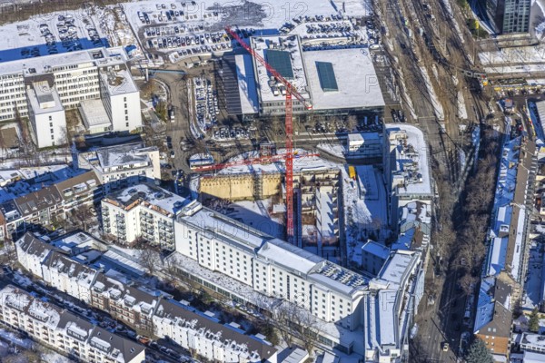 Aerial view, construction site new building office and residential complex, UpperNord Tower Düsseldorf, Mercedesstraße, Düsseltal, Düsseldorf, Rhineland, North Rhine-Westphalia, Germany, construction work, construction, construction area, building site, building plots, construction project, construction site, DE, Europe, aerial view, aerial photography, aerial photography, new building, snow, overview, bird's-eye view, winter, birds-eyes view, overview