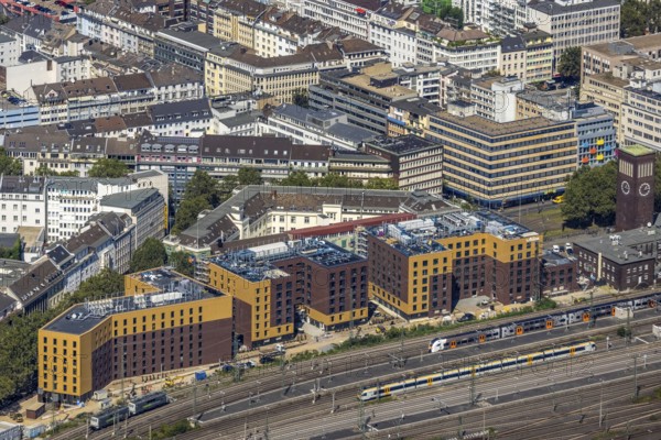 Aerial view, construction site and new hotel buildings for Adina Apartment Hotel, Hampton by Hilton and Premier Inn at Düsseldorf Hbf Stadtmitte in Düsseldorf, Rhineland, North Rhine-Westphalia, Germany, railway tracks, railway station, construction work, construction area, building site, building plots, construction crane, construction measure, construction project, construction site, DE, Deutsche Bahn AG, Düsseldorf, Düsseldorf main station, development, Europe, Düsseldorf-Mettmann tax office, gastronomy, main station, main railway station, hotel, hotel facilities, hotel industry, capacity requirements, aerial view, aerial photography, aerial photography, new construction, overview, bird's-eye view, overview
