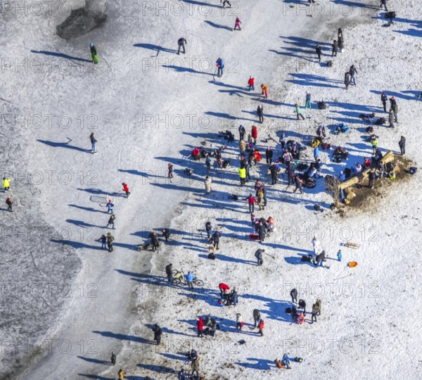 Aerial view, ice rink, ice skaters and pedestrians on frozen Rhine meadow in Lörrick near the Theodor-Heuss-Bridge, Niederkassel, Düsseldorf, Rhineland, North Rhine-Westphalia, Germany, DE, Europe, shapes and colours, aerial view, aerial photography, aerial photography, ice skating, snow, overview, bird's eye view, winter, birds-eyes view, overview