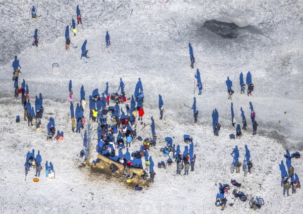 Aerial view, ice rink, ice skaters and pedestrians on frozen Rhine meadow in Lörrick near the Theodor-Heuss-Bridge, Niederkassel, Düsseldorf, Rhineland, North Rhine-Westphalia, Germany, DE, Europe, shapes and colours, aerial view, aerial photography, aerial photography, ice skating, snow, overview, bird's eye view, winter, birds-eyes view, overview