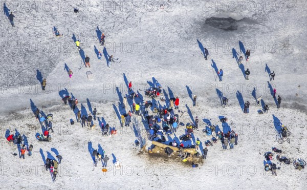 Aerial view, ice rink, ice skaters and pedestrians on frozen Rhine meadow in Lörrick near the Theodor-Heuss-Bridge, Niederkassel, Düsseldorf, Rhineland, North Rhine-Westphalia, Germany, DE, Europe, shapes and colours, aerial view, aerial photography, aerial photography, ice skating, snow, overview, bird's eye view, winter, birds-eyes view, overview