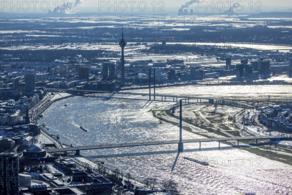 Aerial view, river Rhine with Oberkasseler Brücke, Rheinkniebrücke and Rheinturm, Altstadt, Düsseldorf, Rhineland, North Rhine-Westphalia, Germany, bridge, DE, Europe, river Rhine, aerial view, aerial photography, aerial photography, snow, tower, overview, bird's eye view, winter, birds-eyes view, overview