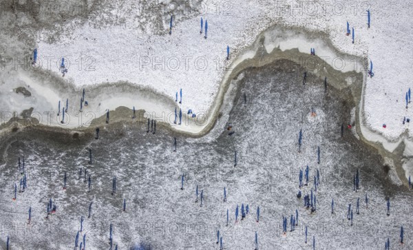 Aerial view, ice rink, ice skaters and pedestrians on frozen Rhine meadow in Lörrick near the Theodor-Heuss-Bridge, Niederkassel, Düsseldorf, Rhineland, North Rhine-Westphalia, Germany, DE, Europe, shapes and colours, aerial view, aerial photography, aerial photography, ice skating, snow, overview, bird's eye view, winter, birds-eyes view, overview