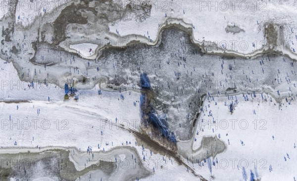 Aerial view, ice rink, ice skaters and pedestrians on frozen Rhine meadow in Lörrick near the Theodor-Heuss-Bridge, Niederkassel, Düsseldorf, Rhineland, North Rhine-Westphalia, Germany, DE, Europe, shapes and colours, aerial view, aerial photography, aerial photography, ice skating, snow, overview, bird's eye view, winter, birds-eyes view, overview
