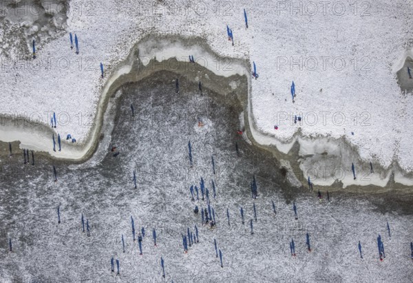 Aerial view, ice rink, ice skaters and pedestrians on frozen Rhine meadow in Lörrick near the Theodor-Heuss-Bridge, Niederkassel, Düsseldorf, Rhineland, North Rhine-Westphalia, Germany, DE, Europe, shapes and colours, aerial view, aerial photography, aerial photography, ice skating, snow, overview, bird's eye view, winter, birds-eyes view, overview