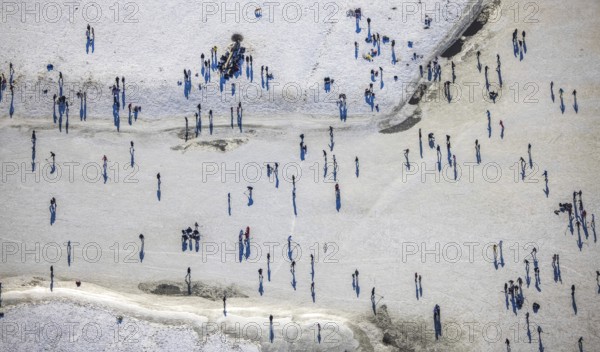 Aerial view, ice rink, ice skaters and pedestrians on frozen Rhine meadow in Lörrick near the Theodor-Heuss-Bridge, Niederkassel, Düsseldorf, Rhineland, North Rhine-Westphalia, Germany, DE, Europe, shapes and colours, aerial view, aerial photography, aerial photography, ice skating, snow, overview, bird's eye view, winter, birds-eyes view, overview