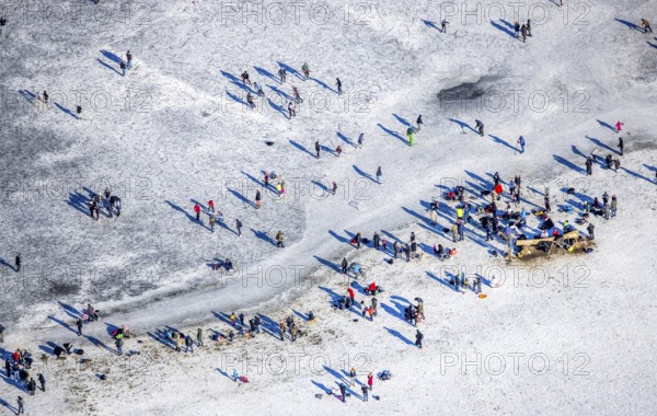 Aerial view, ice rink, ice skaters and pedestrians on frozen Rhine meadow in Lörrick near the Theodor-Heuss-Bridge, Niederkassel, Düsseldorf, Rhineland, North Rhine-Westphalia, Germany, DE, Europe, shapes and colours, aerial view, aerial photography, aerial photography, ice skating, snow, overview, bird's eye view, winter, birds-eyes view, overview