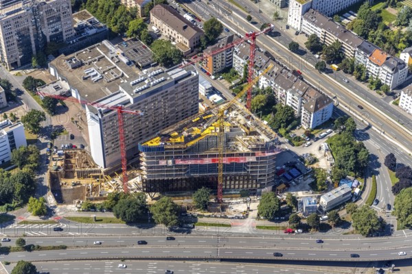 Aerial view, construction site and new construction of the three-storey Eclipse high-rise building next to the Hilton Hotel on Kennedydamm in the Golzheim district, Düsseldorf, Rhineland, North Rhine-Westphalia, Germany, construction work, construction area, construction site, building plots, construction project, construction site, DE, Europe, gastronomy, hotel, hotel facilities, hotel industry, aerial view, aerial photography, aerial photography, new construction, overview, bird's-eye view, overview
