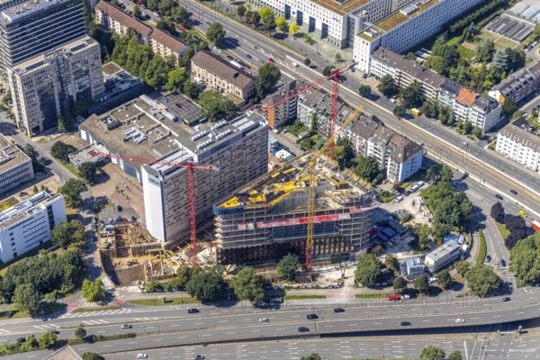 Aerial view, construction site and new construction of the three-storey Eclipse high-rise building next to the Hilton Hotel on Kennedydamm in the Golzheim district, Düsseldorf, Rhineland, North Rhine-Westphalia, Germany, construction work, construction area, construction site, building plots, construction project, construction site, DE, Europe, gastronomy, hotel, hotel facilities, hotel industry, aerial view, aerial photography, aerial photography, new construction, overview, bird's-eye view, overview