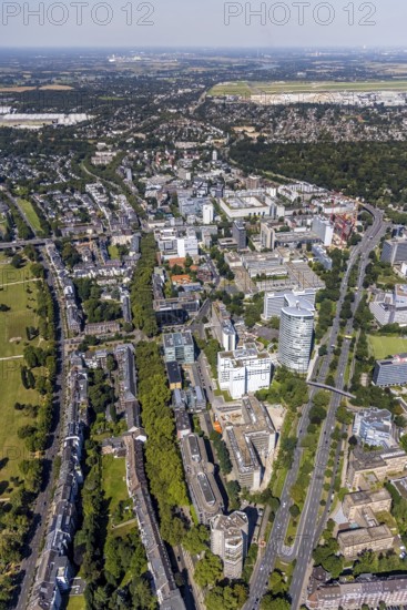 Aerial view, site view as well as construction site and new construction of the three-storey high-rise building Eclipse next to the Hilton Hotel on Kennedydamm in the Golzheim district, Düsseldorf, Rhineland, North Rhine-Westphalia, Germany, construction work, construction area, construction site, building plots, construction project, construction site, DE, Europe, gastronomy, hotel, hotel facilities, hotel industry, aerial view, aerial photography, aerial photography, new construction, overview, bird's-eye view, overview