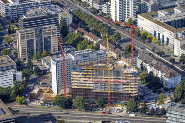 Aerial view, construction site and new construction triangular office tower Eclipse next to the Hilton Hotel at Kennedydamm in the district Golzheim in Düsseldorf, Rhineland, North Rhine-Westphalia, Germany, construction work, construction area, construction site, building plots, construction project, construction site, DE, triangular shape, Düsseldorf, Europe, gastronomy, hotel, hotel facilities, hotel industry, aerial view, aerial photography, aerial photography, new construction, overview, bird's eye view, birds-eyes view, overview