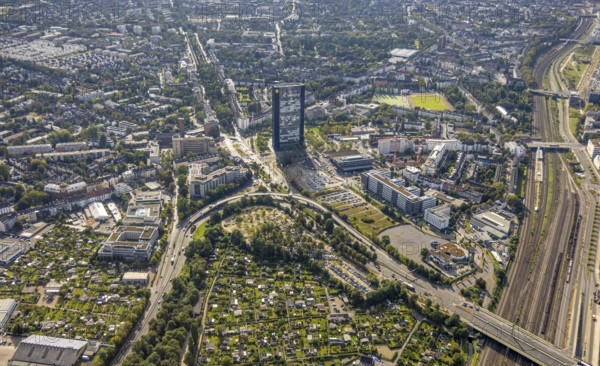 Aerial view, ARAG Tower with construction site on Mercedesstraße with new construction of an office and residential complex in the Düsseltal district of Düsseldorf, Rhineland, North Rhine-Westphalia, Germany, ARAG high-rise building, construction work, construction, construction area, construction site, building plots, construction crane, construction measure, construction project, construction site, CG Gruppe AG, DE, Düsseldorf, development, Europe, commercial buildings, property tax, high-rise buildings, real estate, capacity requirements, aerial view, aerial photography, aerial photography, new construction, overview, bird's-eye view, residential complex, living and working, residential area, residential buildings, birds-eyes view, overview