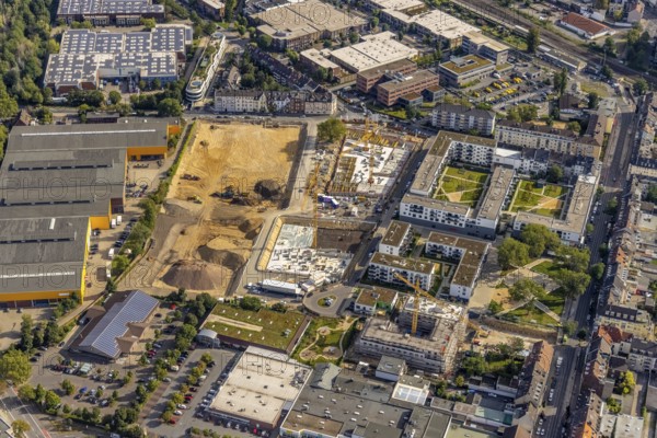 Aerial view, construction site and new building flats Am Gatherhof at the former premises of the company Paguag and the Rather Carree in the district Rath in Düsseldorf, Rhineland, North Rhine-Westphalia, Germany, construction work, construction area, construction site, building plots, construction project, construction site, DE, Düsseldorf, shopping square, shopping centre, Europe, aerial view, aerial photography, aerial photography, Rather Carré, shopping centre, overview, bird's eye view, birds-eyes view, overview