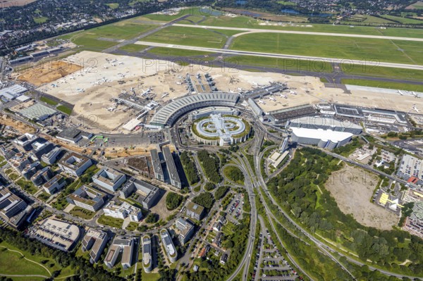 Aerial view, Düsseldorf Airport and Air Park business centre in the Lohausen district of Düsseldorf, Rhineland, North Rhine-Westphalia, Germany, terminal building, DE, Düsseldorf, Düsseldorf Airport, reception building, Europe, flight mission, airport, aircraft noise, airfield, aircraft, commercial buildings, aerial photograph, aerial photography, aerial photography, overview, bird's-eye view, overview