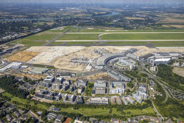 Aerial view, Düsseldorf Airport and Air Park business centre in the Lohausen district of Düsseldorf, Rhineland, North Rhine-Westphalia, Germany, terminal building, DE, Düsseldorf, Düsseldorf Airport, reception building, Europe, flight mission, airport, aircraft noise, airfield, aircraft, commercial buildings, aerial photograph, aerial photography, aerial photography, overview, bird's-eye view, overview