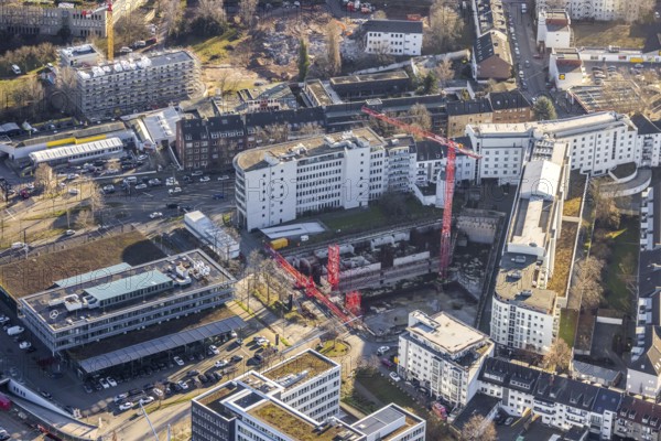Aerial view, construction site at the corner of Mercedesstraße and Münsterstraße with new construction of an office and residential complex in the Düsseltal district of Düsseldorf, Rhineland, North Rhine-Westphalia, Germany, construction work, building, construction area, building site, building plots, construction crane, construction project, construction site, CG Gruppe AG, DE, Düsseldorf, development, Europe, commercial buildings, property tax, real estate, capacity requirements, aerial photograph, aerial photography, aerial photography, new construction, overview, bird's-eye view, residential complex, living and working, residential area, residential buildings, birds-eyes view, overview