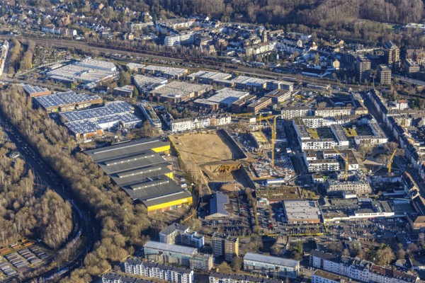 Aerial view, construction site and new construction of flats Am Gatherhof at the former premises of the company Paguag as well as the Rather Carree in the district Rath in Düsseldorf, Rhineland, North Rhine-Westphalia, Germany, construction work, construction area, building site, building plots, construction project, construction site, DE, Düsseldorf, shopping square, shopping centre, Europe, aerial view, aerial photography, aerial photography, Rather Carré, shopping centre, overview, bird's eye view, birds-eyes view, overview