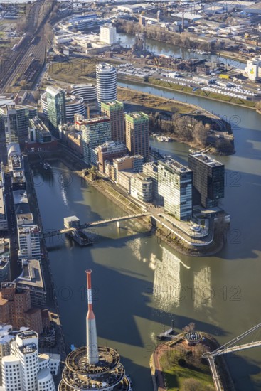 Aerial view, office buildings and commercial buildings in the media harbour with Hyatt Regency Düsseldorf in the harbour in Düsseldorf, Rhineland, North Rhine-Westphalia, Germany, DE, Düsseldorf, Europe, commercial enterprises, commercial area, commercial park, commercial location, commercial use, harbour area, industrial area, industrial location, aerial photograph, aerial photography, aerial photography, overview, bird's eye view, birds-eyes view, overview