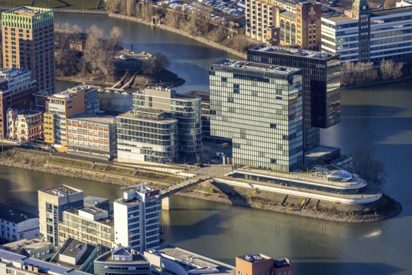 Aerial view, office buildings and commercial buildings in the media harbour with Hyatt Regency Düsseldorf in the harbour in Düsseldorf, Rhineland, North Rhine-Westphalia, Germany, DE, Düsseldorf, Europe, commercial enterprises, commercial area, commercial park, commercial location, commercial use, harbour area, industrial area, industrial location, aerial photograph, aerial photography, aerial photography, overview, bird's eye view, birds-eyes view, overview