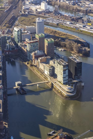 Aerial view, office buildings and commercial buildings in the media harbour with Hyatt Regency Düsseldorf in the harbour in Düsseldorf, Rhineland, North Rhine-Westphalia, Germany, DE, Düsseldorf, Europe, commercial enterprises, commercial area, commercial park, commercial location, commercial use, harbour area, industrial area, industrial location, aerial photograph, aerial photography, aerial photography, overview, bird's eye view, birds-eyes view, overview