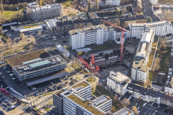 Aerial view, construction site at the corner of Mercedesstraße and Münsterstraße with new construction of an office and residential complex in the Düsseltal district of Düsseldorf, Rhineland, North Rhine-Westphalia, Germany, construction work, building, construction area, building site, building plots, construction crane, construction project, construction site, CG Gruppe AG, DE, Düsseldorf, development, Europe, commercial buildings, property tax, real estate, capacity requirements, aerial photograph, aerial photography, aerial photography, new construction, overview, bird's-eye view, residential complex, living and working, residential area, residential buildings, birds-eyes view, overview