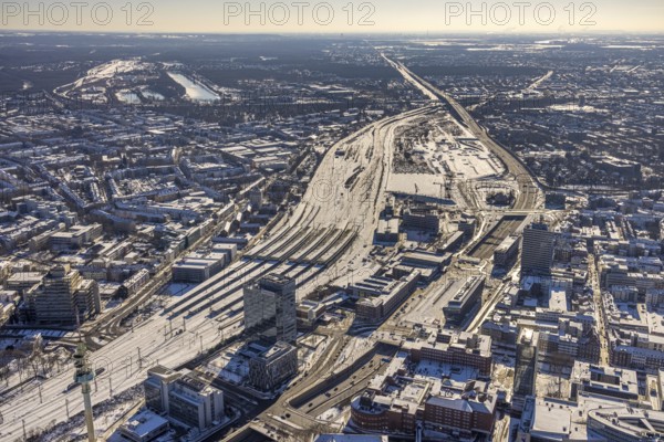 Aerial view, Duisburg central station, Duissern, Duisburg, Ruhr area, North Rhine-Westphalia, Germany, railway station, DE, Deutsche Bahn AG, Europe, railway tracks, central station, main station, junction station, aerial view, aerial photography, aerial photography, Otto-Keller-Straße, snow, overview, bird's eye view, winter, birds-eyes view, cleared roads, overview