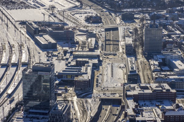 Aerial view, construction site station forecourt, new building Mercator One Duisburg, Mercatorstraße, Duisburg, Ruhr area, North Rhine-Westphalia, Germany, railway station, station forecourt, DE, Deutsche Bahn AG, Europe, gastronomy, railway tracks, main station, main station, hotel, hotel facilities, hotel business, junction station, aerial view, aerial photography, aerial photography, Otto-Keller-Straße, snow, overview, bird's eye view, winter, birds-eyes view, cleared roads, overview
