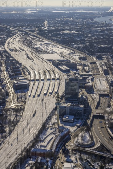 Aerial view, Duisburg central station, Duissern, Duisburg, Ruhr area, North Rhine-Westphalia, Germany, railway station, DE, Deutsche Bahn AG, Europe, railway tracks, central station, main station, junction station, aerial view, aerial photography, aerial photography, Otto-Keller-Straße, snow, overview, bird's eye view, winter, birds-eyes view, cleared roads, overview