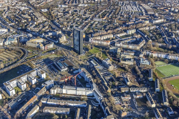 Aerial view, ARAG Tower with construction site on Mercedesstraße with new construction of an office and residential complex in the Düsseltal district of Düsseldorf, Rhineland, North Rhine-Westphalia, Germany, ARAG high-rise building, construction work, construction, construction area, construction site, building plots, construction crane, construction measure, construction project, construction site, CG Gruppe AG, DE, Düsseldorf, development, Europe, commercial buildings, property tax, high-rise buildings, real estate, capacity requirements, aerial view, aerial photography, aerial photography, new construction, overview, bird's-eye view, residential complex, living and working, residential area, residential buildings, birds-eyes view, overview