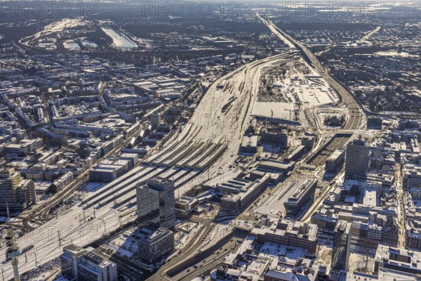 Aerial view, Duisburg central station, Duissern, Duisburg, Ruhr area, North Rhine-Westphalia, Germany, railway station, DE, Deutsche Bahn AG, Europe, railway tracks, central station, main station, junction station, aerial view, aerial photography, aerial photography, Otto-Keller-Straße, snow, overview, bird's eye view, winter, birds-eyes view, cleared roads, overview