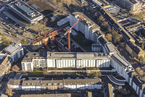 Aerial view, construction site at the corner of Mercedesstraße and Münsterstraße with new construction of an office and residential complex in the Düsseltal district of Düsseldorf, Rhineland, North Rhine-Westphalia, Germany, construction work, building, construction area, building site, building plots, construction crane, construction project, construction site, CG Gruppe AG, DE, Düsseldorf, development, Europe, commercial buildings, property tax, real estate, capacity requirements, aerial photograph, aerial photography, aerial photography, new construction, overview, bird's-eye view, residential complex, living and working, residential area, residential buildings, birds-eyes view, overview