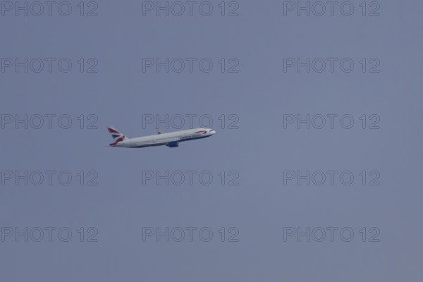 Boeing 787-9 Dreamliner jet passenger aircraft of British Airways airlines in flight in a blue sky, London, England, United Kingdom