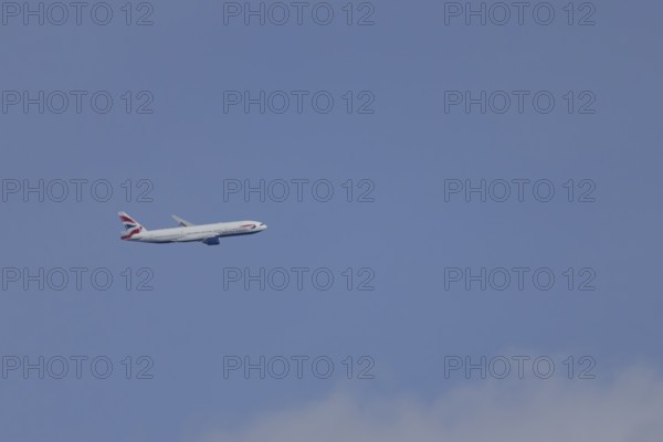 Boeing 787-9 Dreamliner jet passenger aircraft of British Airways airlines in flight in a blue sky, London, England, United Kingdom