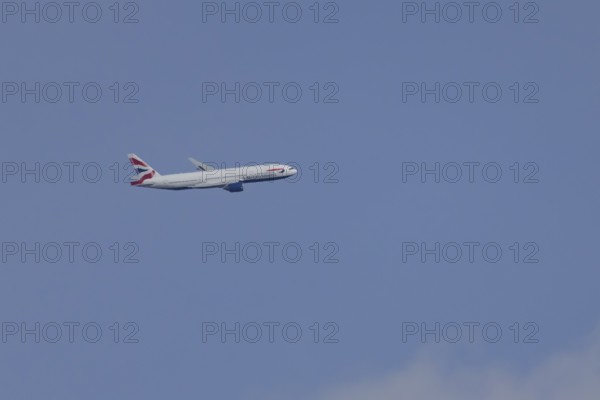 Boeing 787-9 Dreamliner jet passenger aircraft of British Airways airlines in flight in a blue sky, London, England, United Kingdom