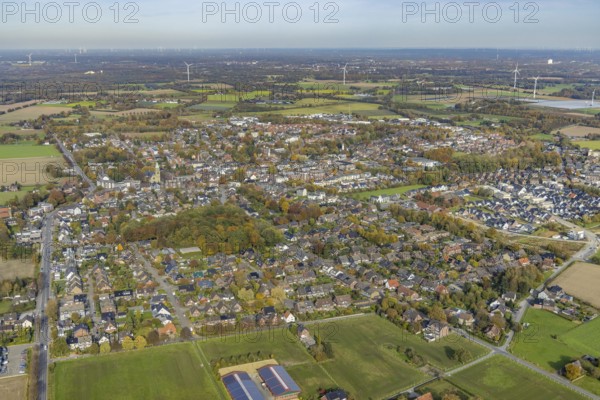 Aerial view, townscape with catholic church St. John the Baptist in the district Kirchhellen in Bottrop, Ruhr area, North Rhine-Westphalia, Germany, place of worship, Bottrop, City, DE, Europe, distant view, religious community, place of worship, holy place, city centre, church, parish, denomination, aerial view, aerial photography, aerial photography, site view, religion, religious site, townscape, city centre, overview, bird's eye view, birds-eyes view, overview