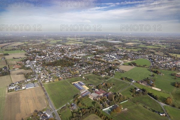Aerial view, townscape with catholic church St. John the Baptist in the district Kirchhellen in Bottrop, Ruhr area, North Rhine-Westphalia, Germany, place of worship, Bottrop, City, DE, Europe, distant view, religious community, place of worship, holy place, city centre, church, parish, denomination, aerial view, aerial photography, aerial photography, site view, religion, religious site, townscape, city centre, overview, bird's eye view, birds-eyes view, overview