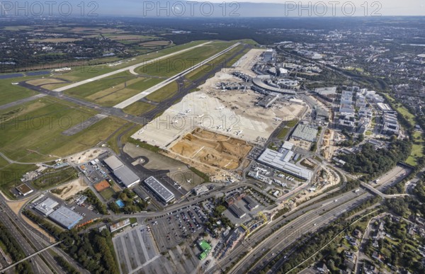 Aerial view, Düsseldorf Airport with construction site in the Lohausen district of Düsseldorf, Rhineland, North Rhine-Westphalia, Germany, construction work, construction area, construction site, building plots, construction project, construction site, DE, Düsseldorf, Europe, flight emission, airport, aircraft noise, airfield, aerial photograph, aerial photography, aerial photography, overview, bird's-eye view, bird's-eye view, overview