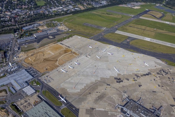 Aerial view, Düsseldorf Airport with construction site in the Lohausen district of Düsseldorf, Rhineland, North Rhine-Westphalia, Germany, construction work, construction area, construction site, building plots, construction project, construction site, DE, Düsseldorf, Europe, flight emission, airport, aircraft noise, airfield, aerial photograph, aerial photography, aerial photography, overview, bird's-eye view, bird's-eye view, overview